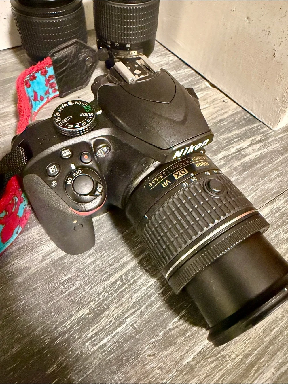 Nikon Camera Kit with Black Lenses and Red Strap